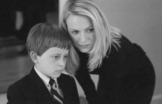 At the funeral wake for her niece, Rachel comforts her young son, Aidan.