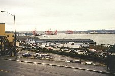 Seattle docks area as seen behind Rachel as she waits for Noah to finish viewing the tape.